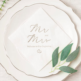 Crisky Mr and Mrs wedding napkins on a stylish table setting for reception.