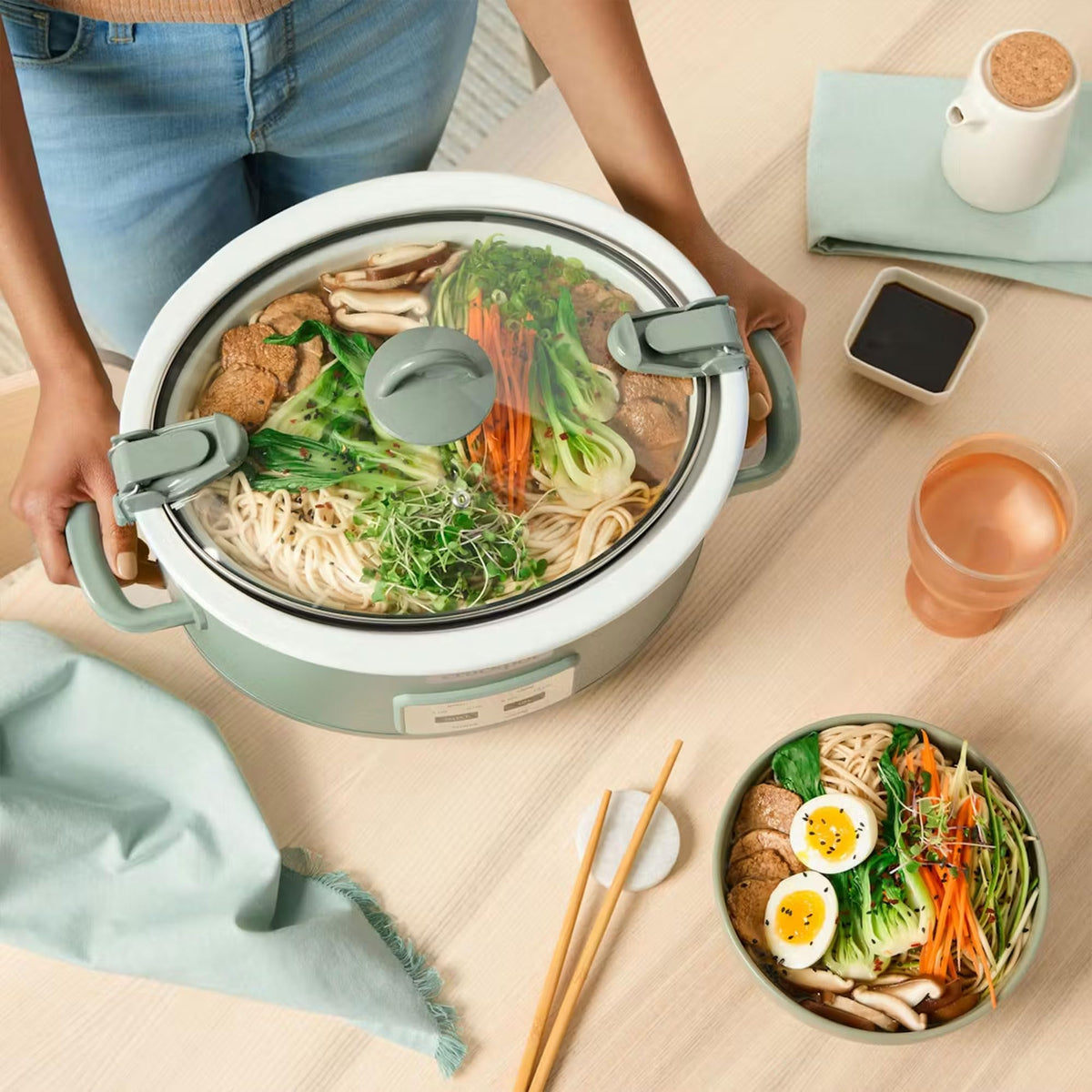 Crock-Pot Auto-Warm maintains serving temperature for easy meals.