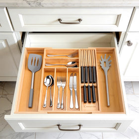 Csoravist space-saving utensil storage with dedicated compartments for utensils.