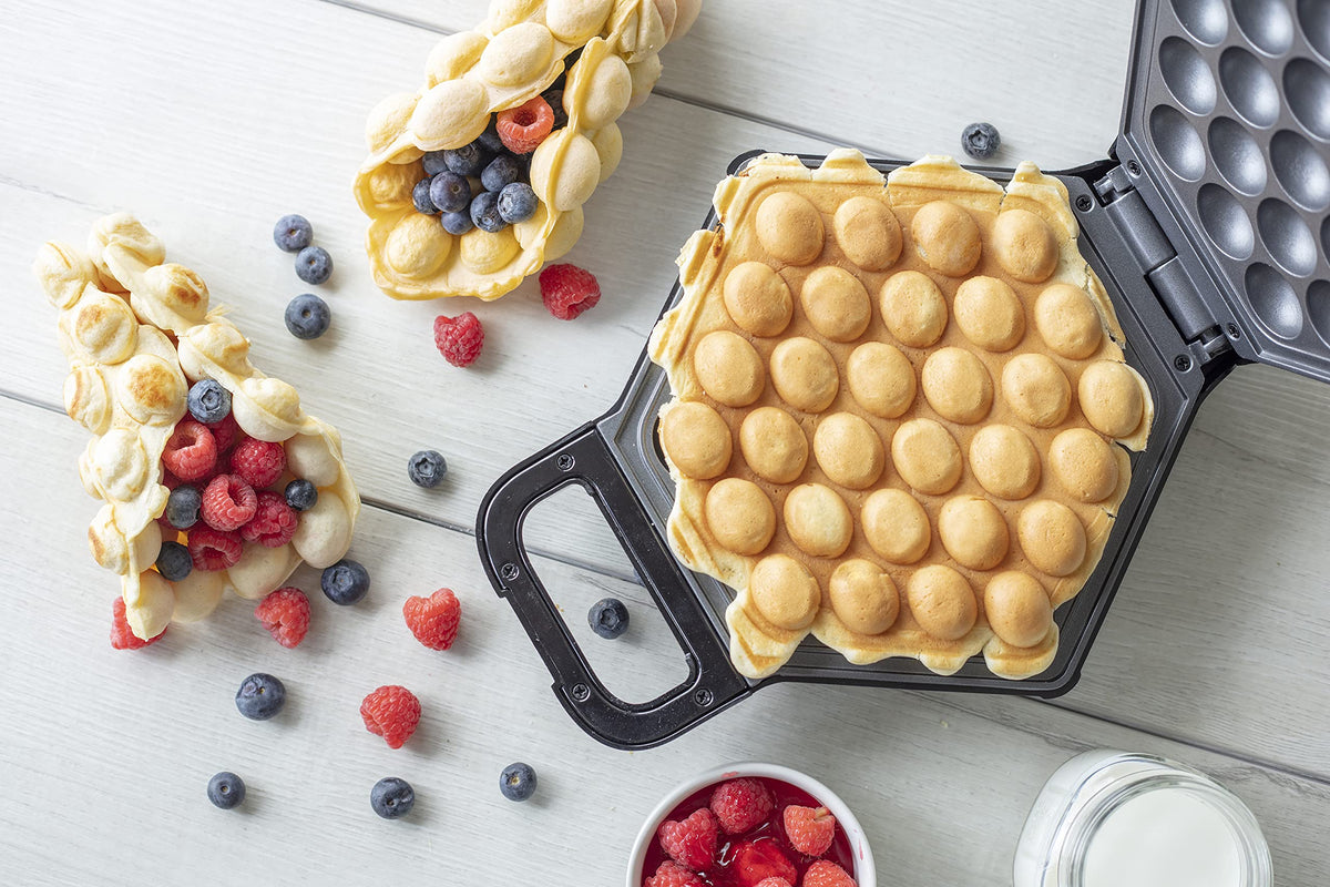 CucinaPro Bubble Waffle Maker serving ice cream cones with warm eggettes.