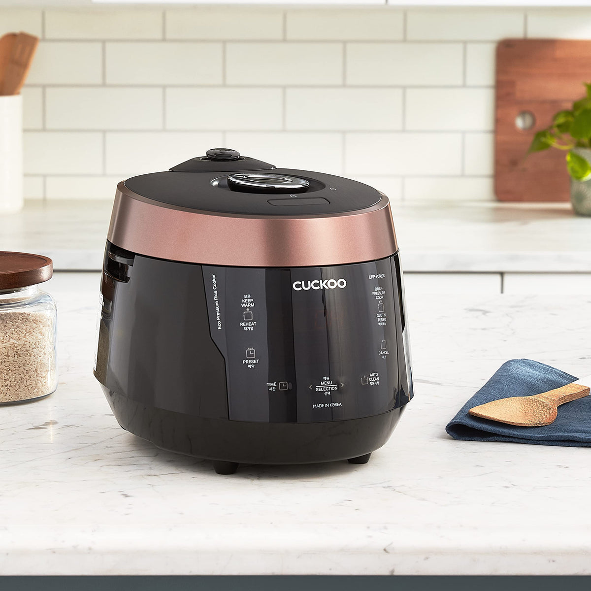 CUCKOO high-pressure rice cooker top panel showing 12-menu options for versatile meals.