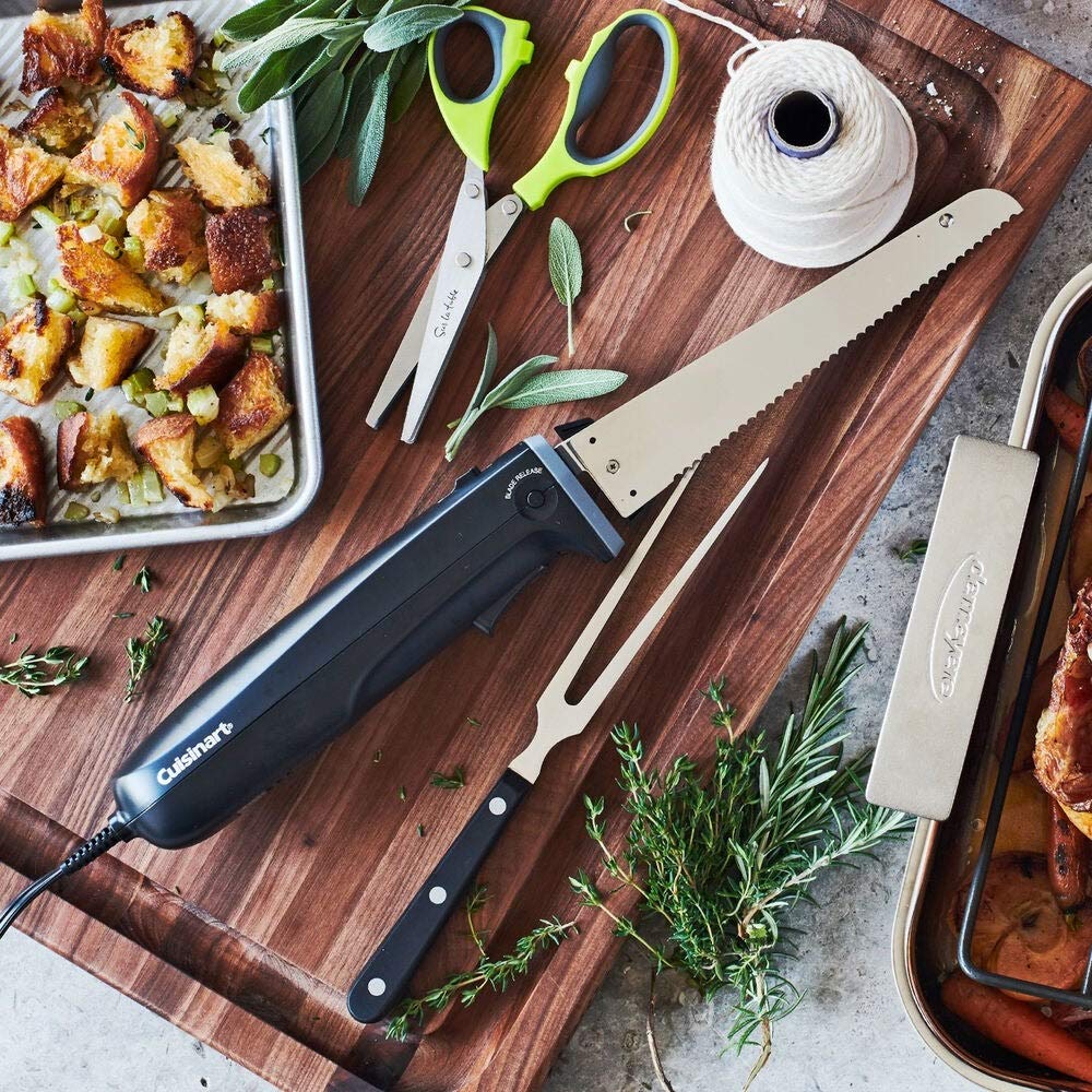 Cuisinart storage tray keeps knife, fork, and board neatly organized on the board.