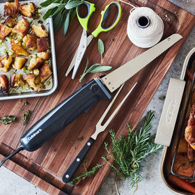 Cuisinart storage tray keeps knife, fork, and board neatly organized on the board.