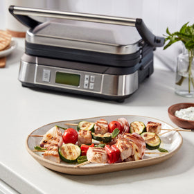 Cuisinart Griddler opens flat to double cooking surface for batch grilling.