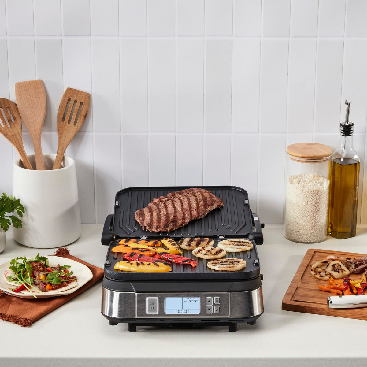 Cuisinart Griddler grease-reducing plates in action for cleaner meals.
