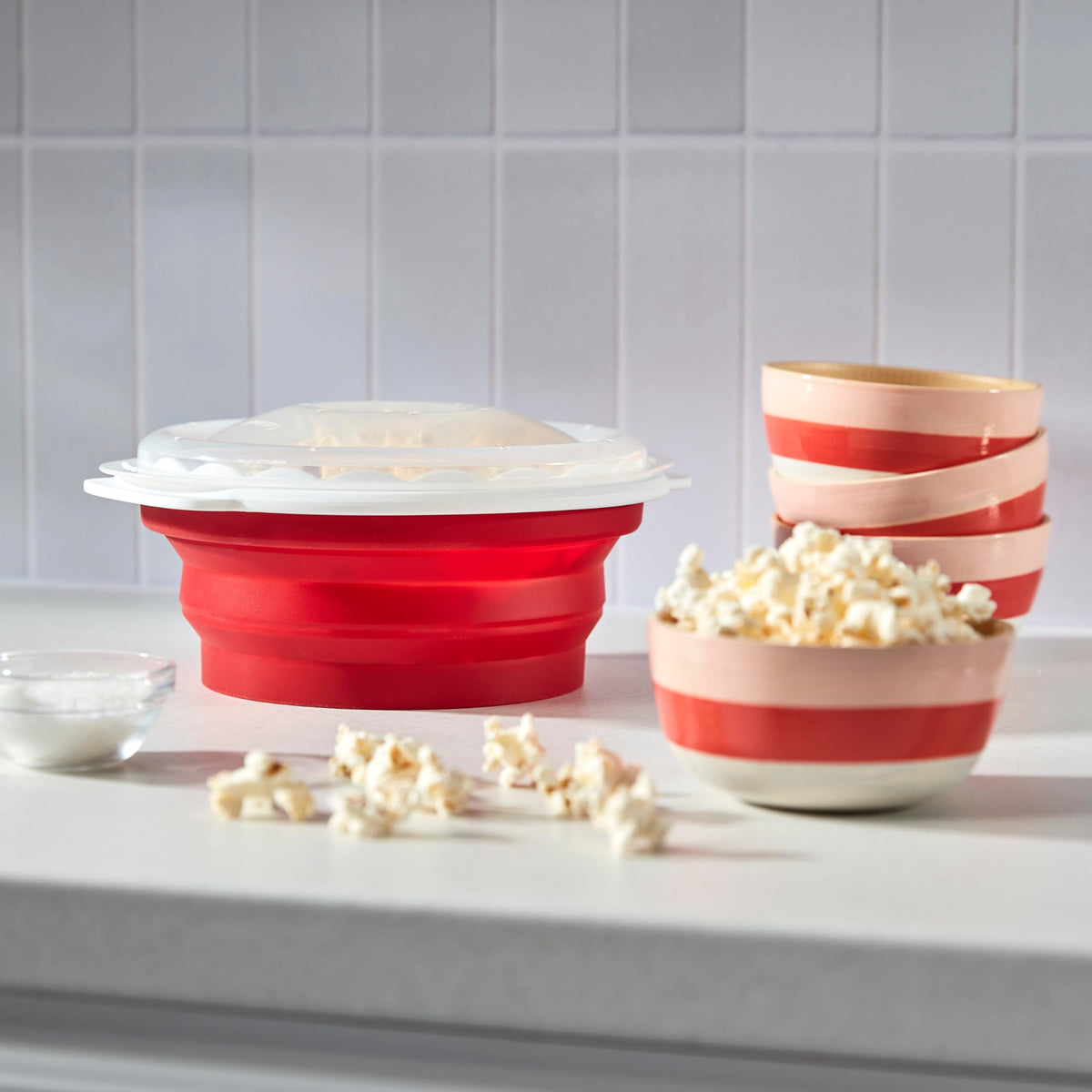 Close-up of kernels popping inside the Cuisinart popcorn maker.