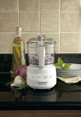 Cuisinart Mini-Prep Plus reversible blade close-up for chopping and grinding tasks.
