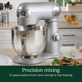 Splash guard with pour spout on the Cuisinart mixer keeps counters clean.