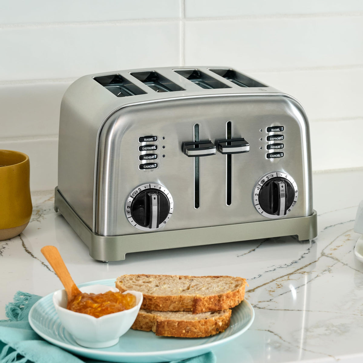 Cuisinart toaster with defrost and reheat controls for frozen breads