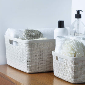 Curver set6 white basket in bedroom for accessories and essentials.