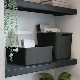 Curver versatile basket complements any décor with a fabric-like look and resin durability.