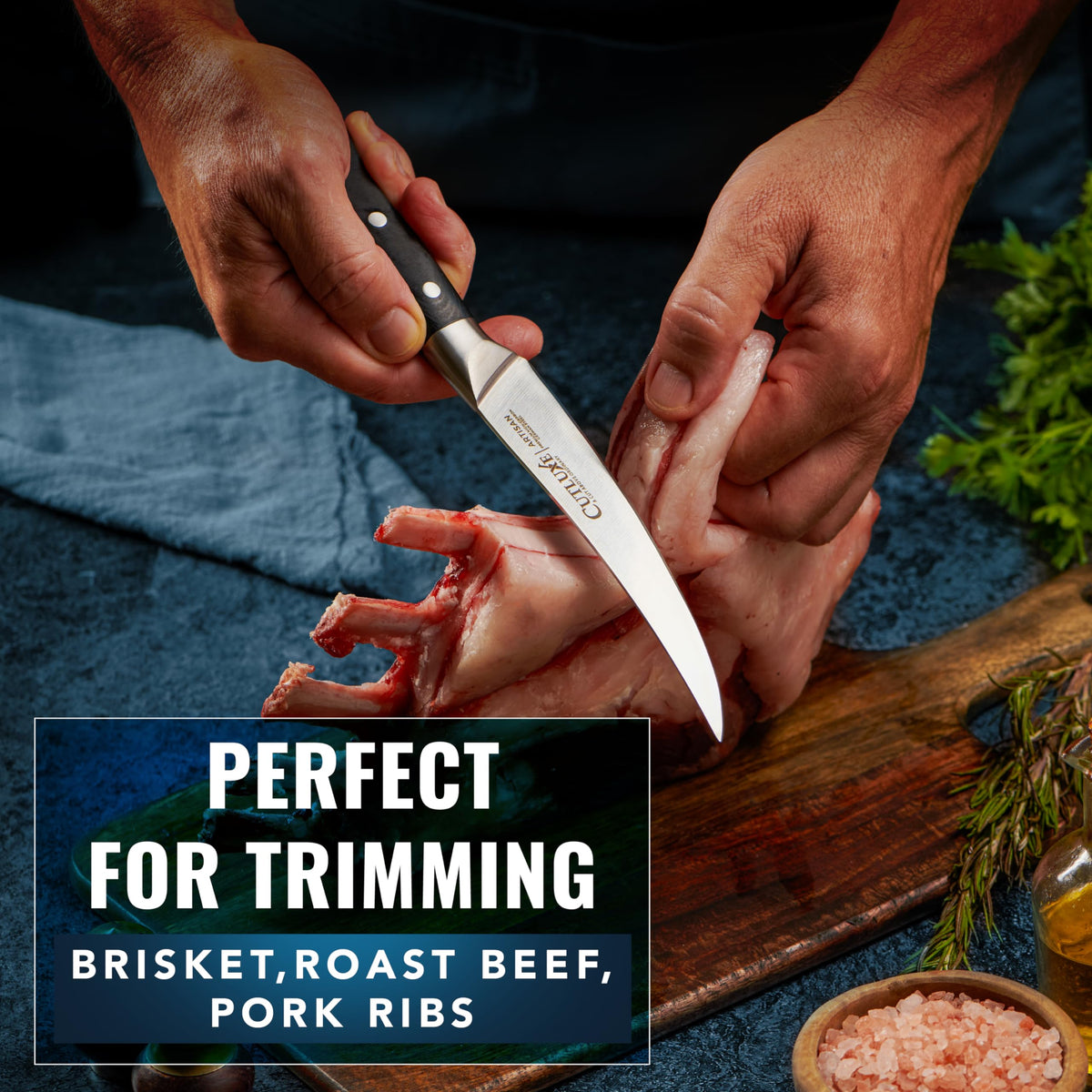Cutluxe curved boning knife in action slicing meat for trimming