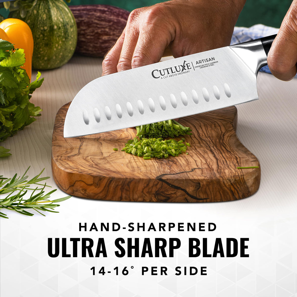 Cutluxe Santoku handle close-up shows ergonomic pakkawood grip.