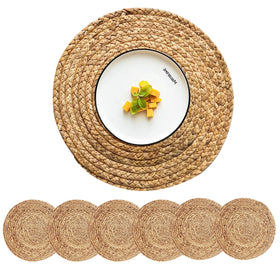 CY SISTERS round placemats in natural water hyacinth add warmth and table protection.