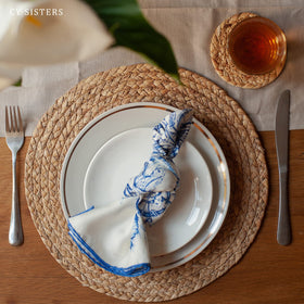 CY SISTERS natural weave pairs with wood, glass, or metal tables.