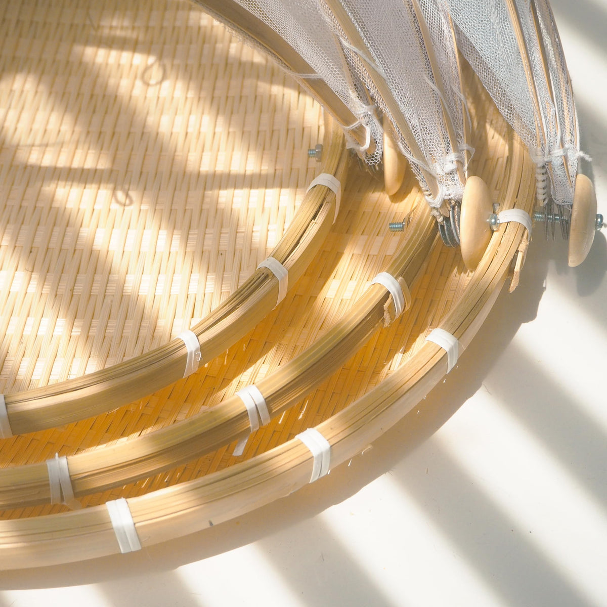 DAIKA BAMECO bamboo fruit basket with lid showing outer mesh cover