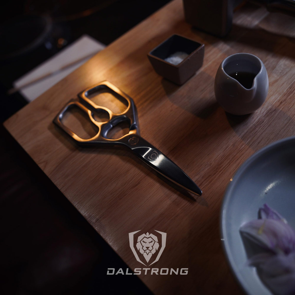 Dalstrong kitchen scissors ready to open packages with multi-task versatility