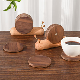 Damuzhi snail-coaster on desk adds stylish decor and practicality.