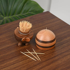 Damuzhi toothpick dispenser highlights walnut grain for premium decor detail.