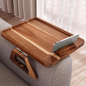 Danfoxer acacia wood couch arm tray on sofa for drinks, snacks, and devices.