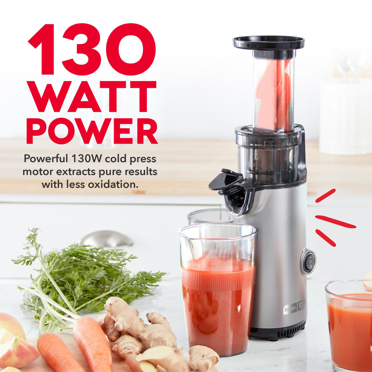 DASH Deluxe compact juicer pouring juice with smooth, pulp-free texture.