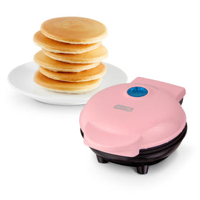 Dash Mini Maker Griddle pink, compact design ideal for small kitchens.