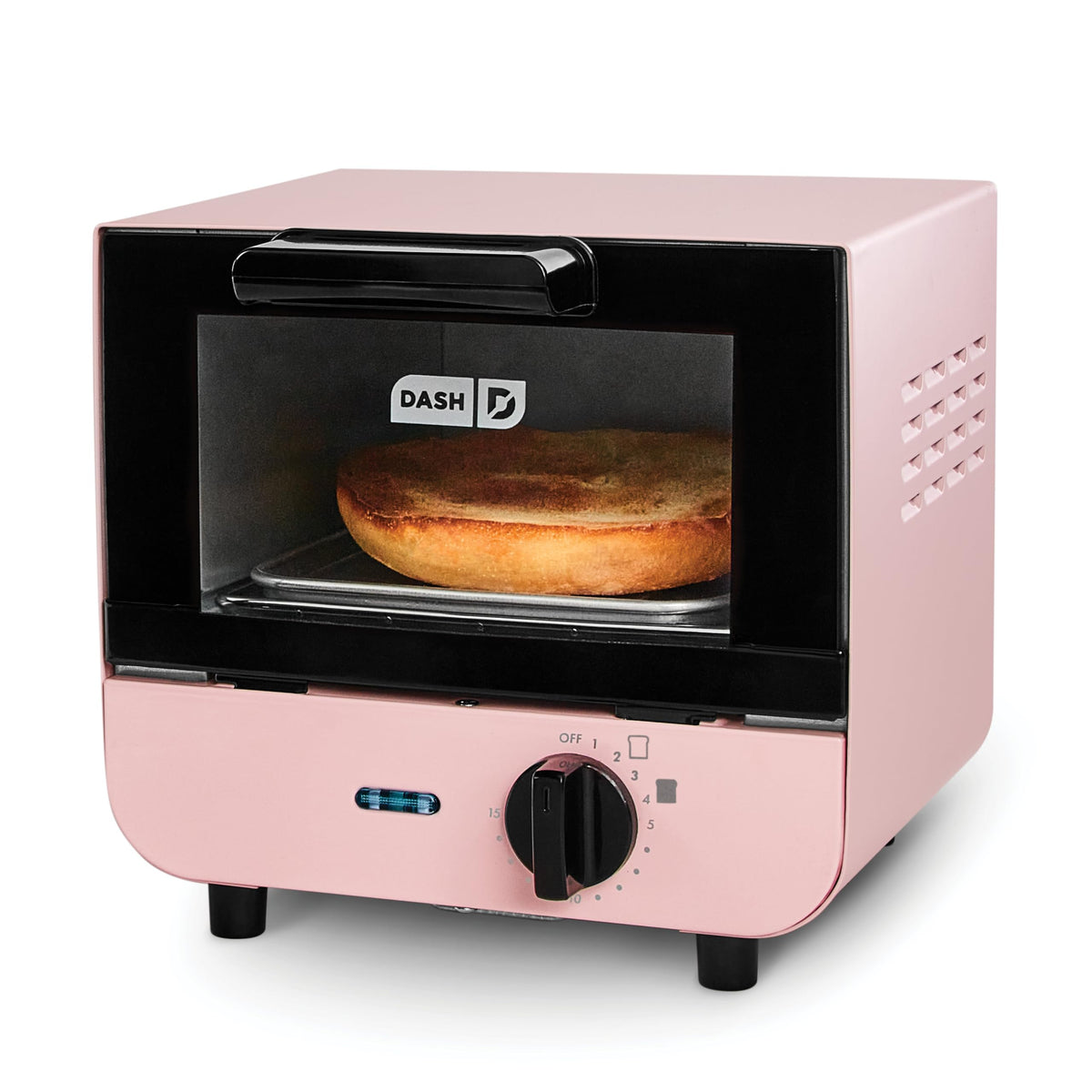 DASH mini toaster oven on counter in pink, compact design ideal for small kitchens.