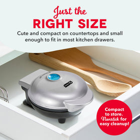 DASH Mini Waffle Maker with golden waffle, showing fast, even cooking.