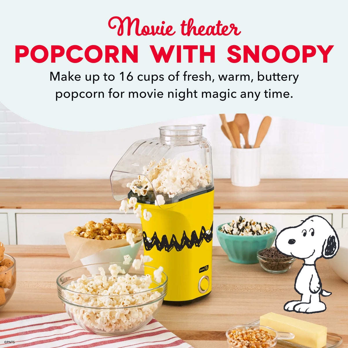 DASH Peanuts Fresh Pop popcorn maker measuring cup doubles as butter tray.
