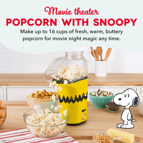 DASH Peanuts Fresh Pop popcorn maker measuring cup doubles as butter tray.