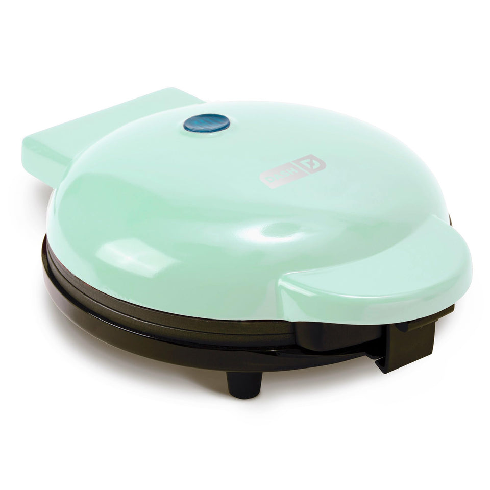 Dash Round Express Electric Pancake Maker on the counter delivering quick, evenly browned pancakes with a nonstick surface.