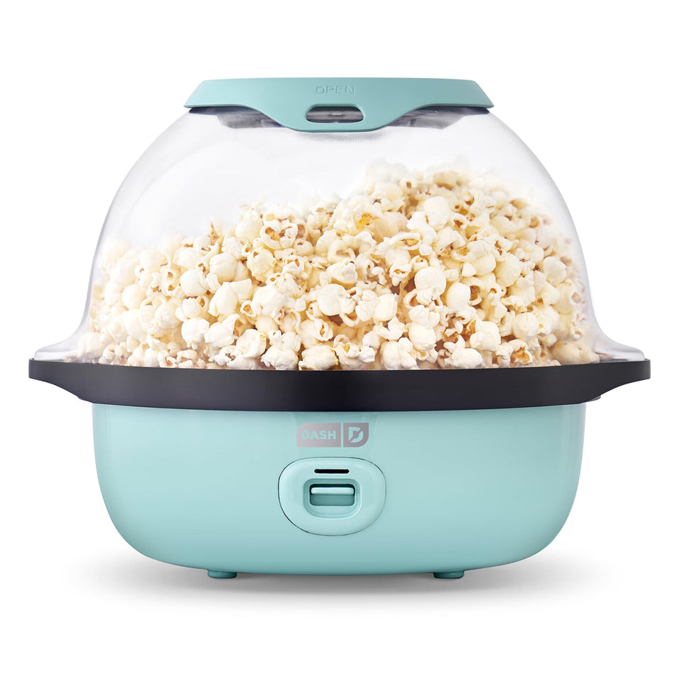 Dash SmartStore Deluxe stirring popcorn maker front view showing theater-style popcorn.