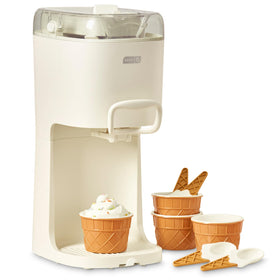 Dash Soft Serve Machine on a kitchen counter delivering smooth, ready-to-serve desserts at home.
