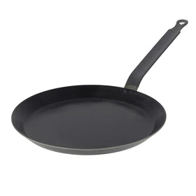 De Buyer blue carbon steel pan close-up surface demonstrates natural non-stick potential.
