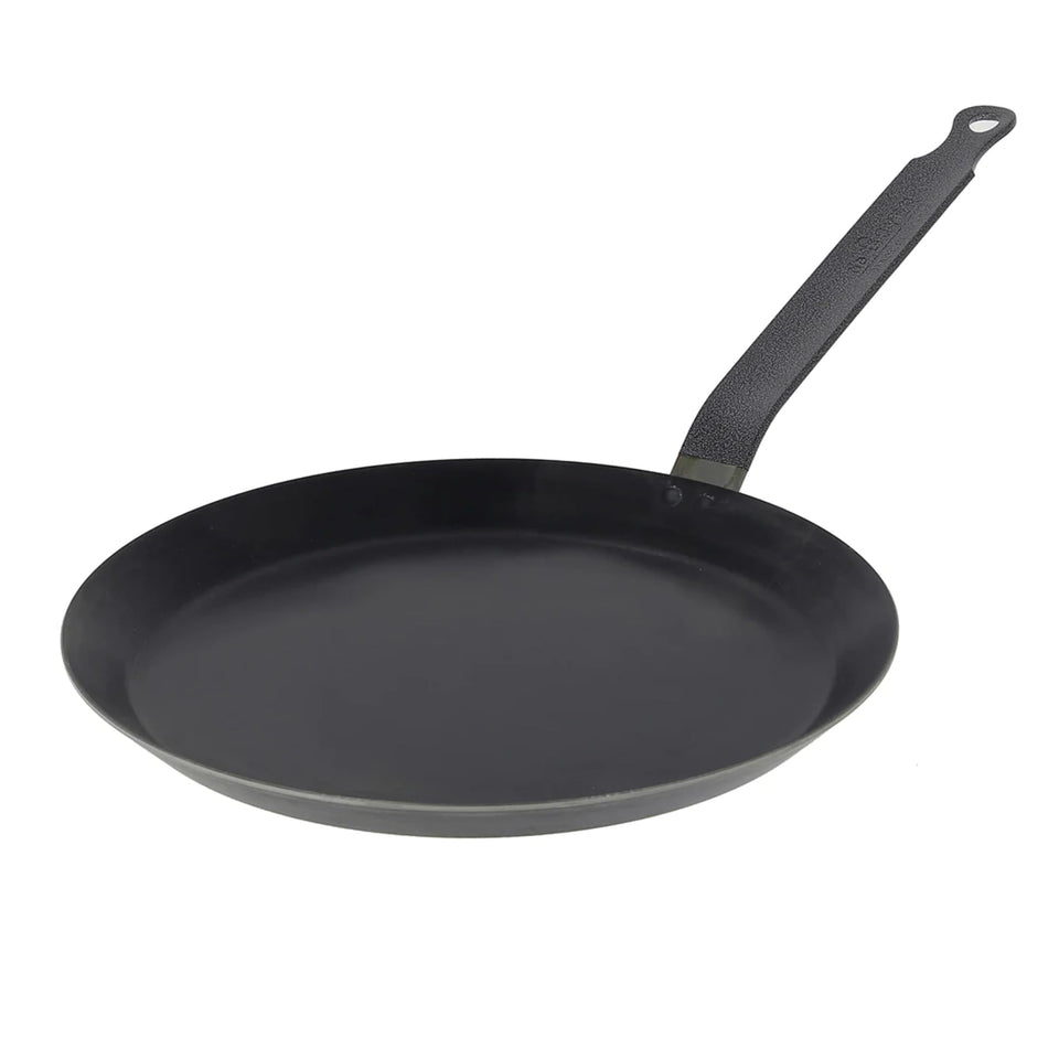 De Buyer blue carbon steel pan close-up surface demonstrates natural non-stick potential.