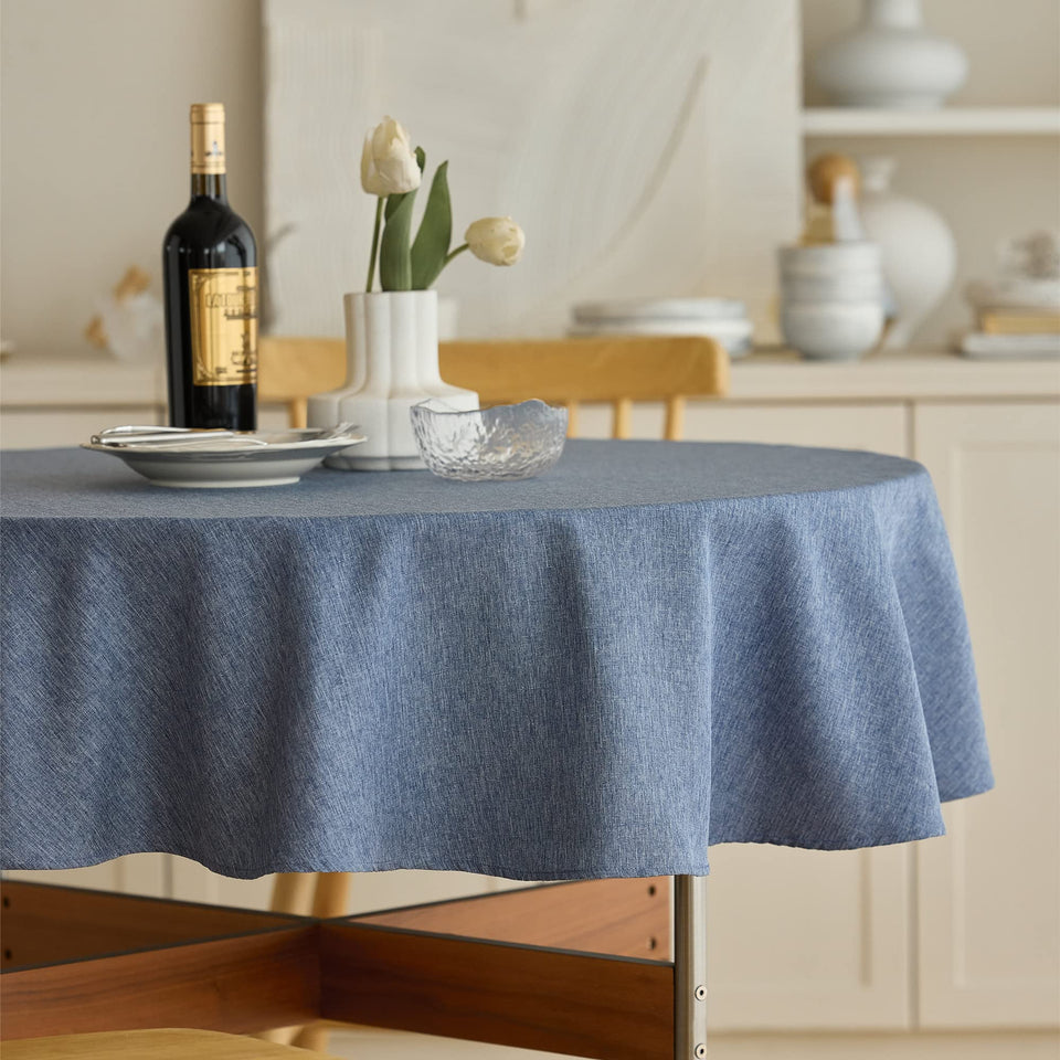 Decorelia denim blue round tablecloth waterproof for outdoor dining and easy cleanup.