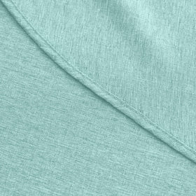 Decorelia farmhouse tablecloth aqua protecting a table surface.