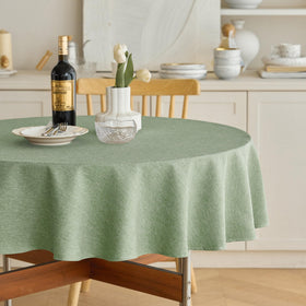 Decorelia faux linen round tablecloth sage green with waterproof protection for spills.