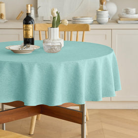 Decorelia waterproof round tablecloth aqua closeup shows spill resistance.