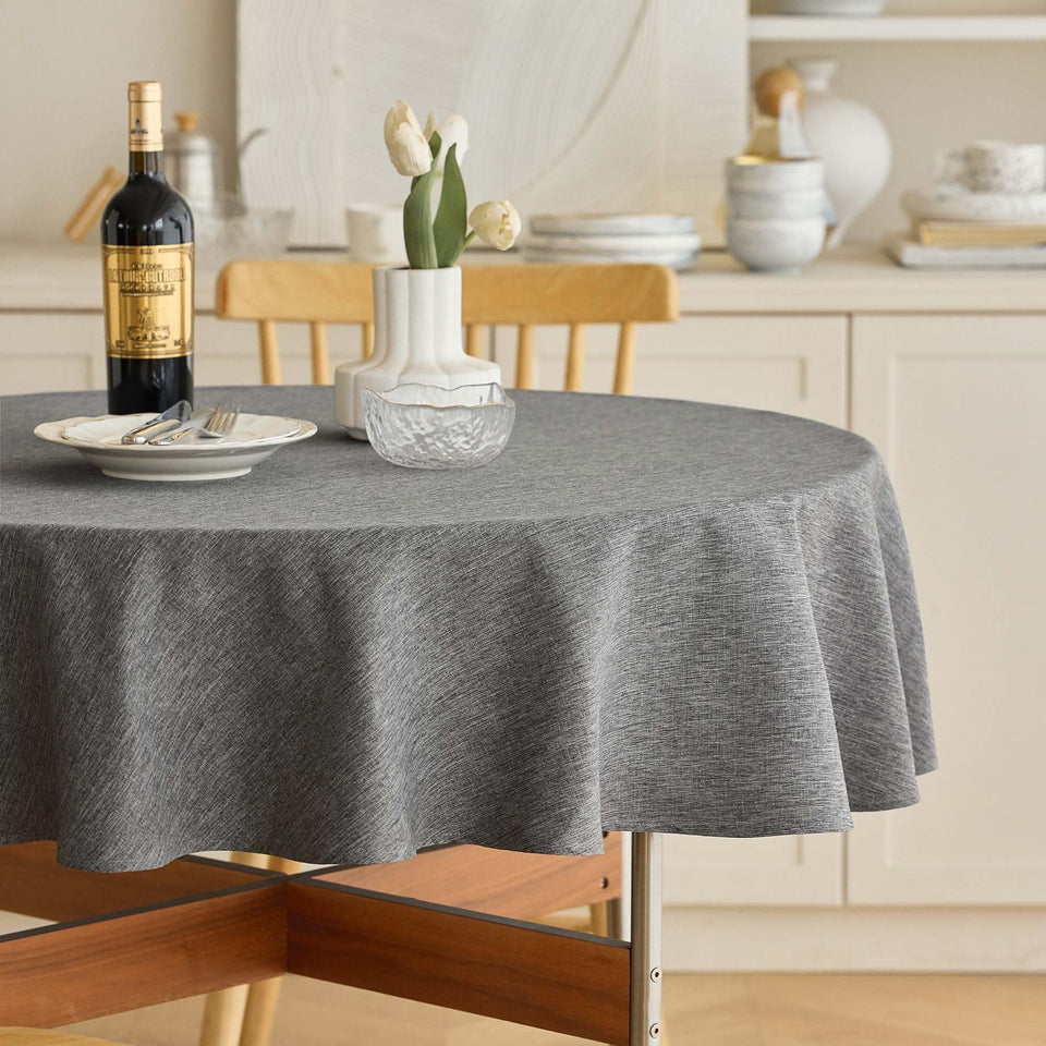Decorelia waterproof 60-inch round tablecloth protects surfaces during meals