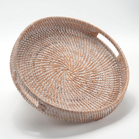 Decrafts Round Rattan Serving Tray with handles on a table for easy serving