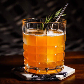 DeeCoo 10oz glass in hand with ice emphasizes balanced grip and chill