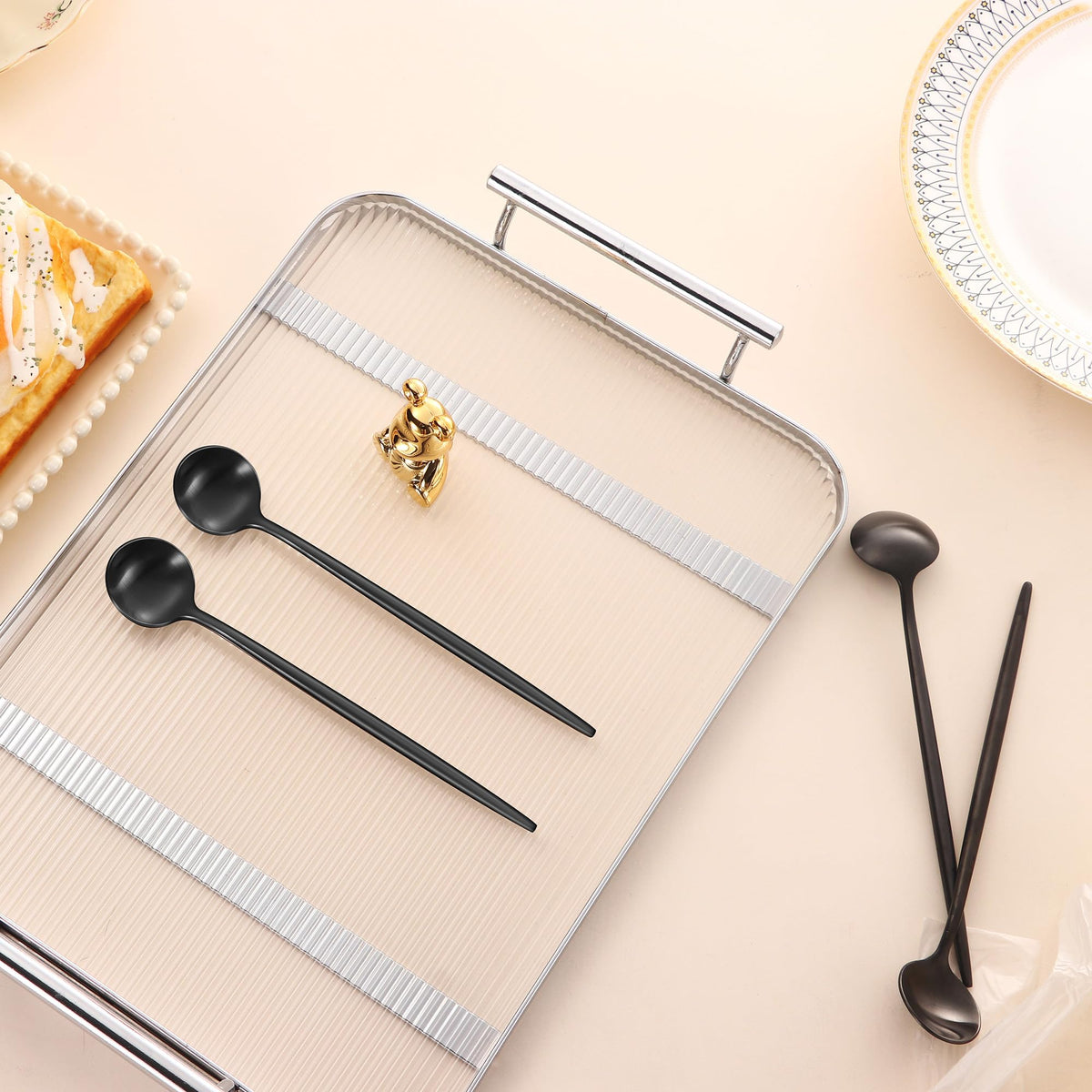 Elegant Dehov four-piece spoon set for modern table settings.