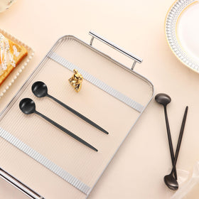Elegant Dehov four-piece spoon set for modern table settings.
