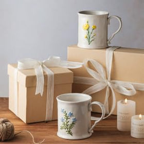 Floral yellow and blue mug brightening kitchen decor and table settings.