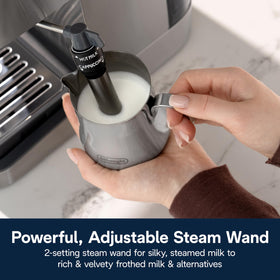 De'Longhi Classic steam wand in focus, adjustable frothing for latte art.