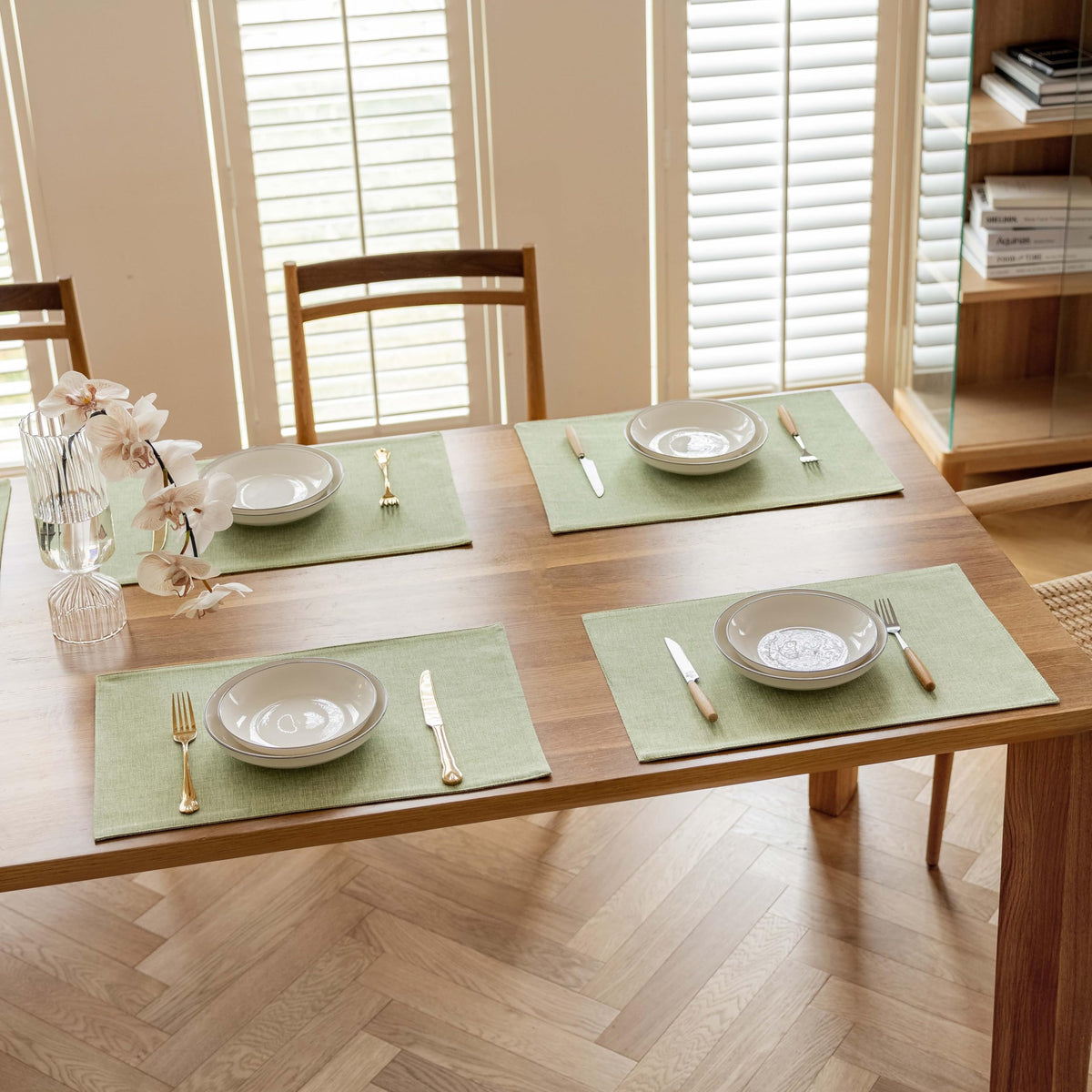 Demetex Green placemats fit standard dining setups on wood or glass tables
