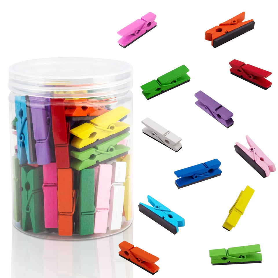 Deoot multicolored magnetic clips on fridge for notes and photos