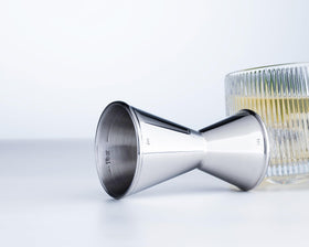 Stainless steel Derrison bar jigger with mirror polish for professional presentation.