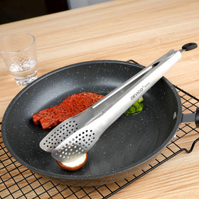 Devico dishwasher-safe tongs shown for convenient cleaning after cooking.